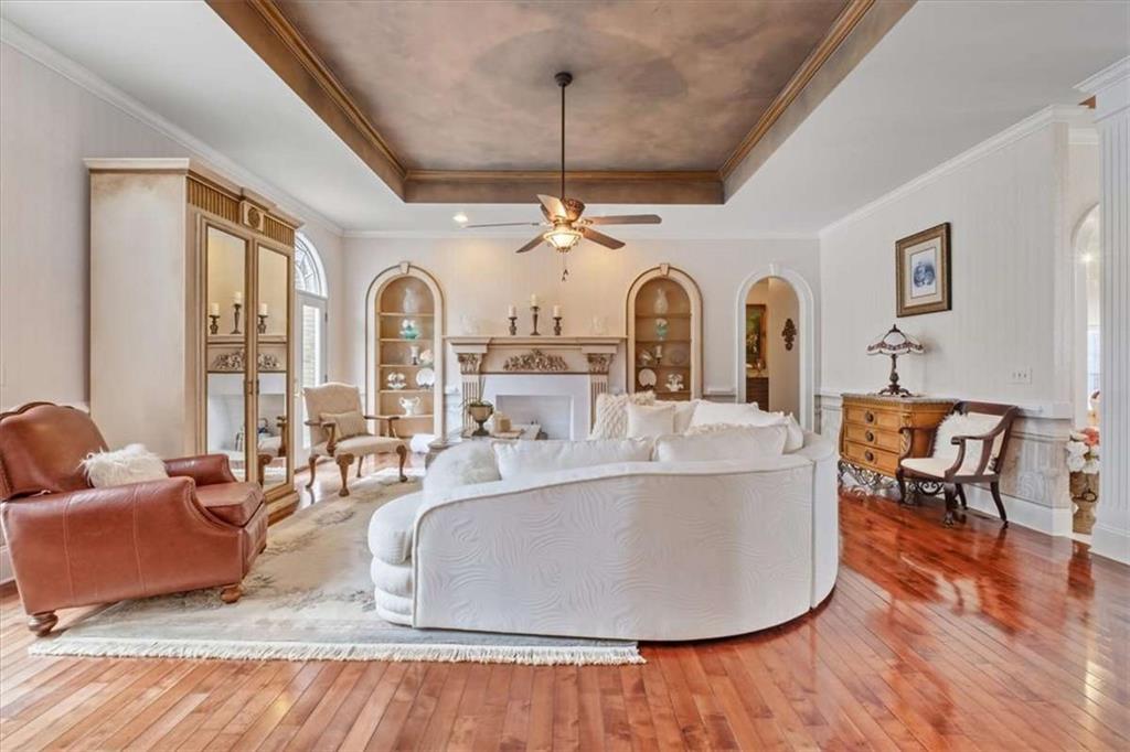 96 Windchime Way Northeast Rome, GA 30161 - Photo 9 of 57 a living room with fireplace furniture and a wooden floor