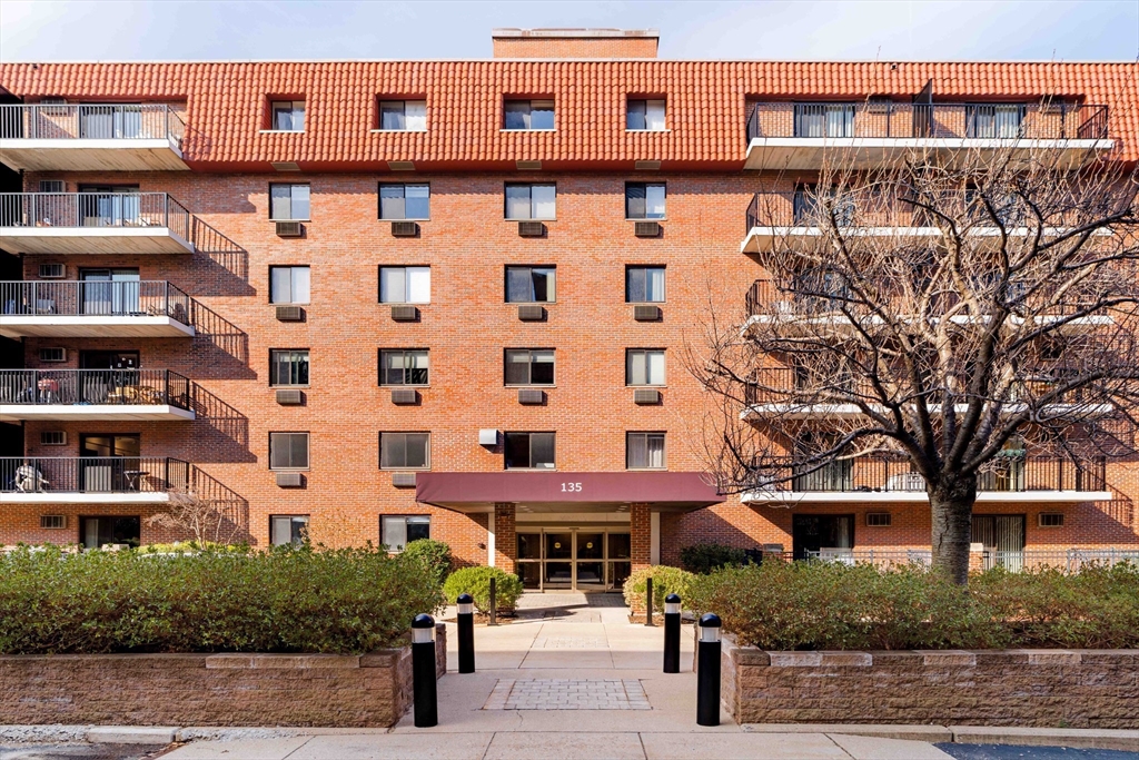 135 Pleasant Street, Unit 207 Brookline, MA 02446 - Photo 1 of 16 a front view of a building