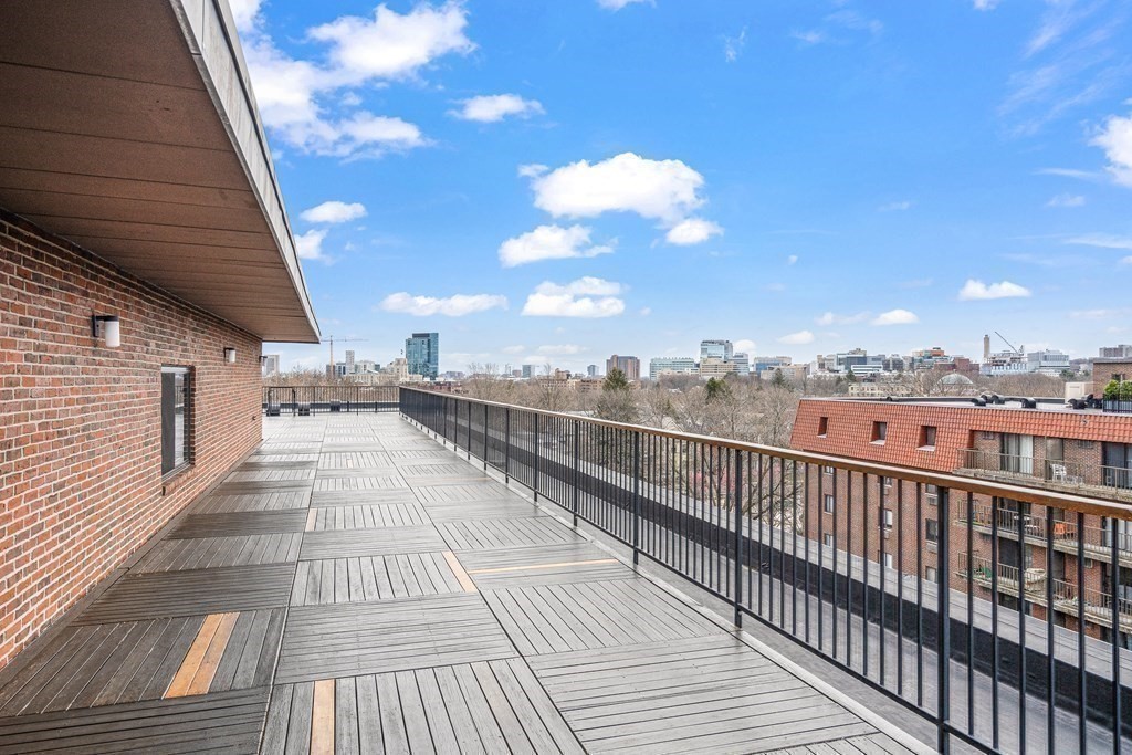 135 Pleasant Street, Unit 207 Brookline, MA 02446 - Photo 11 of 16 a view of city from a balcony