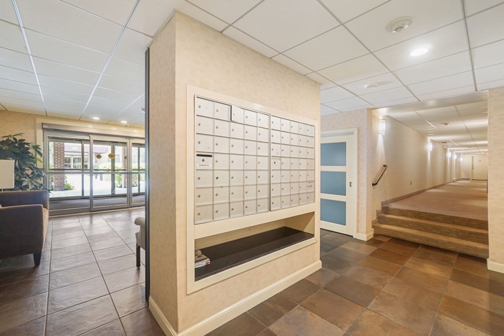 135 Pleasant Street, Unit 207 Brookline, MA 02446 - Photo 14 of 16 a view of entryway with stairs