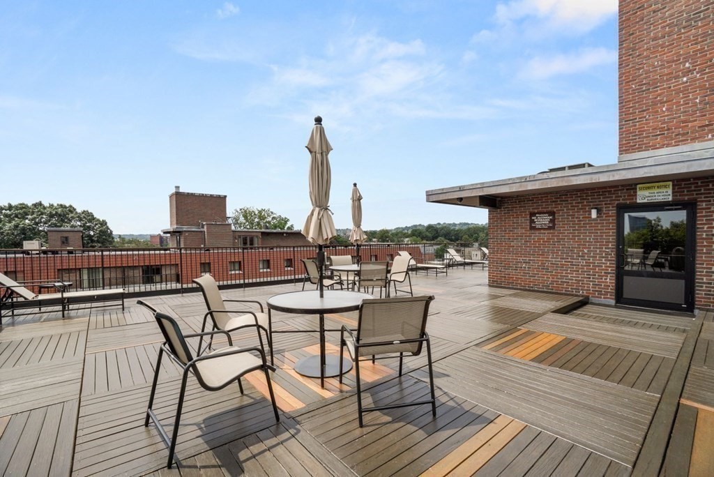 135 Pleasant Street, Unit 207 Brookline, MA 02446 - Photo 9 of 16 a view of a terrace with furniture