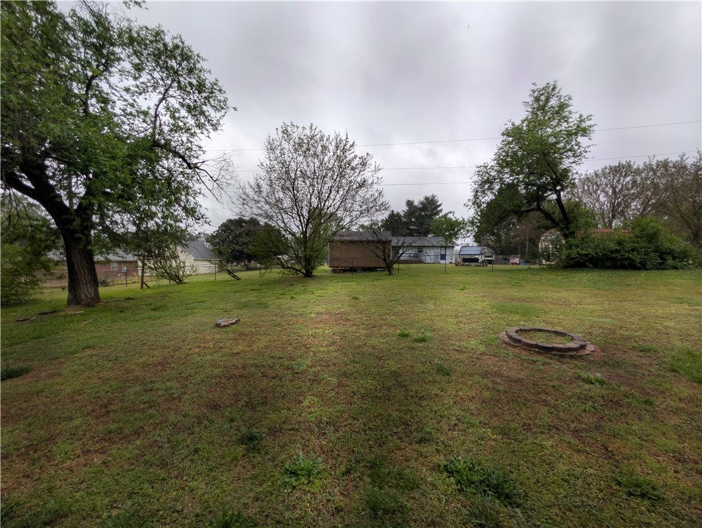 1000 Hickory Lane Anderson, SC 29624 - Photo 36 of 37 This spacious yard offers ample green space and a dedicated fire pit for outdoor enjoyment.