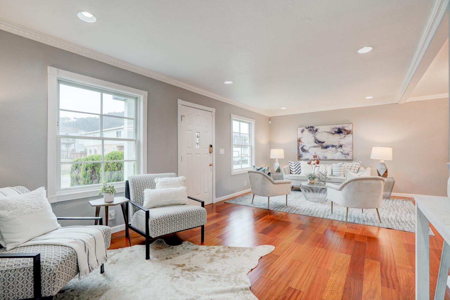 350 Buckingham Way Pacifica, CA 94044 - Photo 11 of 68 a living room with furniture and wooden floor