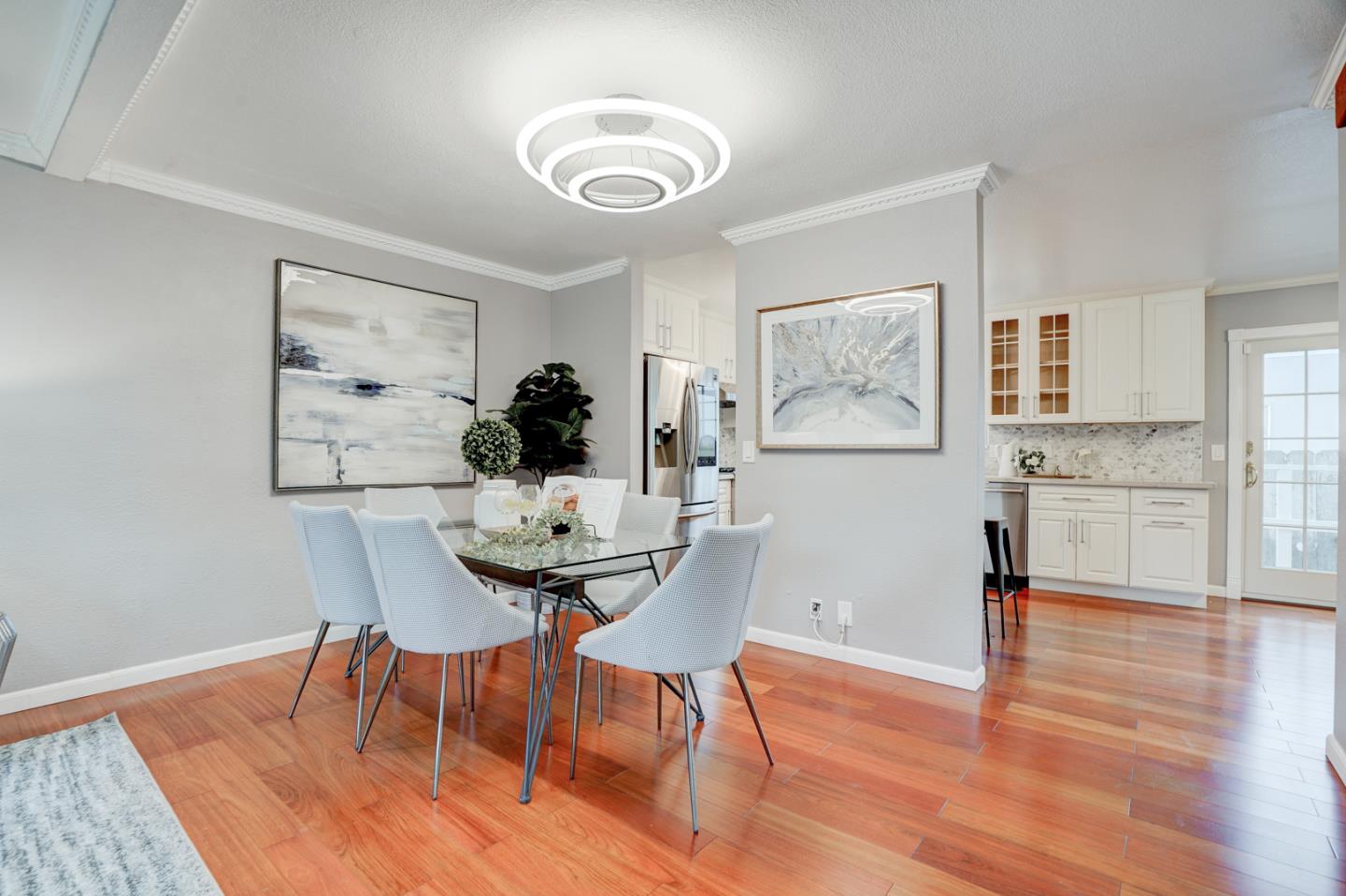 350 Buckingham Way Pacifica, CA 94044 - Photo 13 of 68 a view of a dining room with furniture and wooden floor