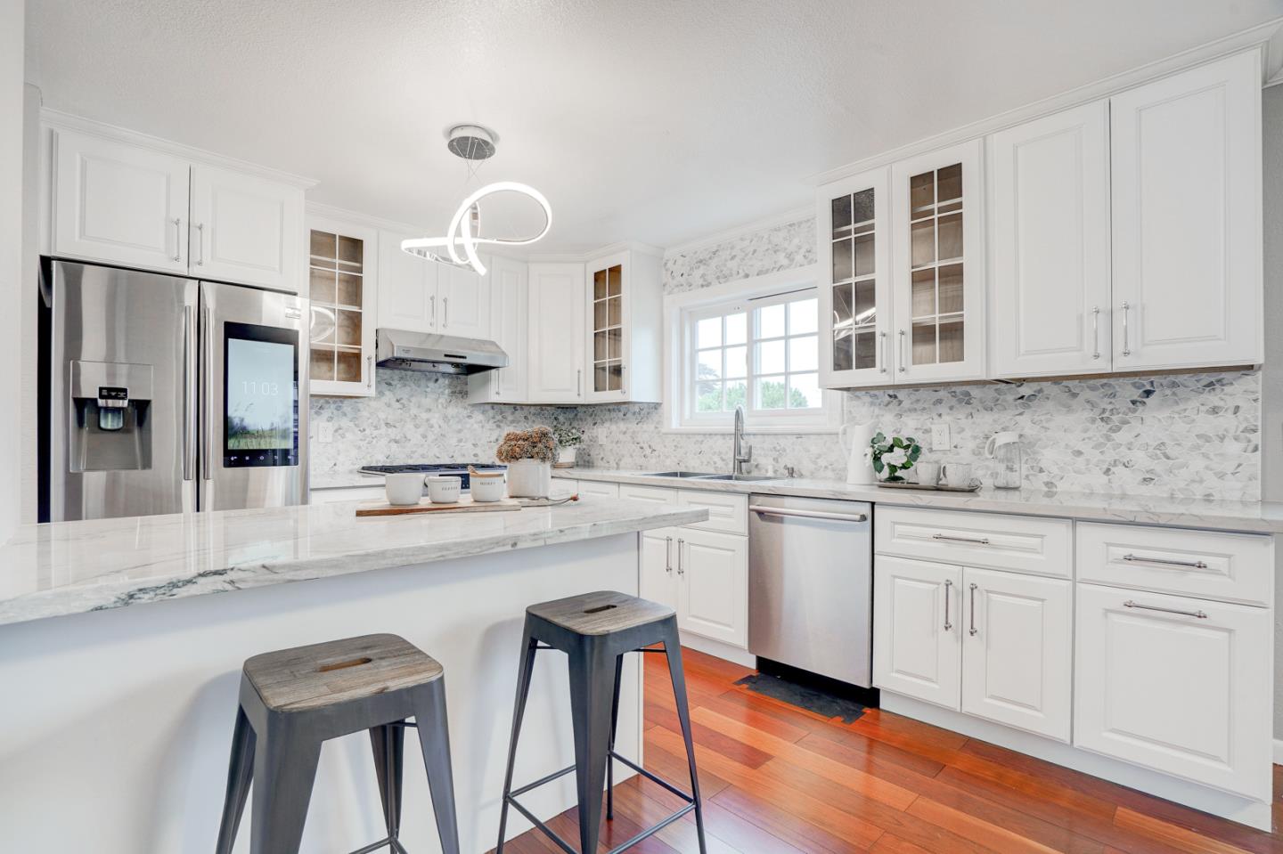 350 Buckingham Way Pacifica, CA 94044 - Photo 19 of 68 a kitchen with stainless steel appliances granite countertop a sink and cabinets