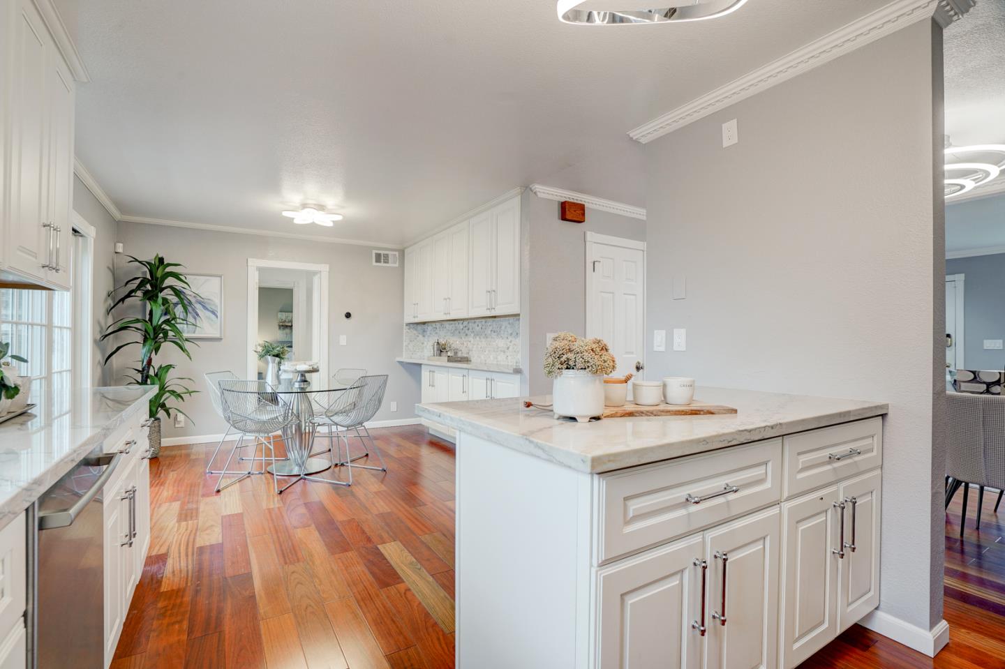 350 Buckingham Way Pacifica, CA 94044 - Photo 21 of 68 a view of a kitchen with kitchen island a counter top space a sink and cabinets