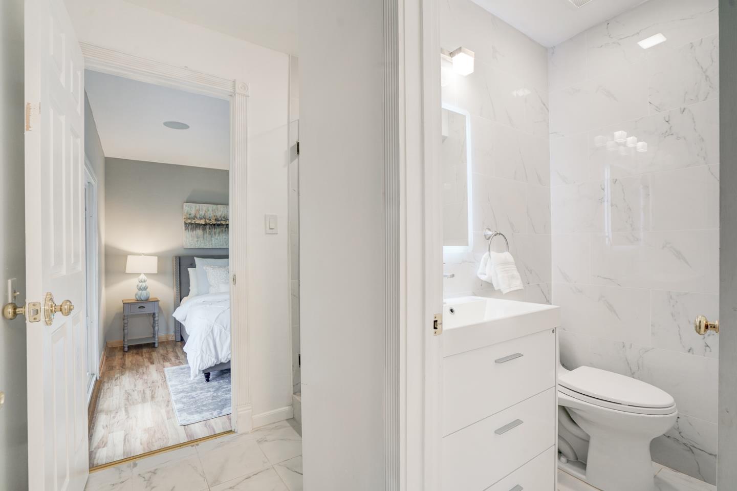 350 Buckingham Way Pacifica, CA 94044 - Photo 25 of 68 a bathroom with a sink a toilet and a mirror