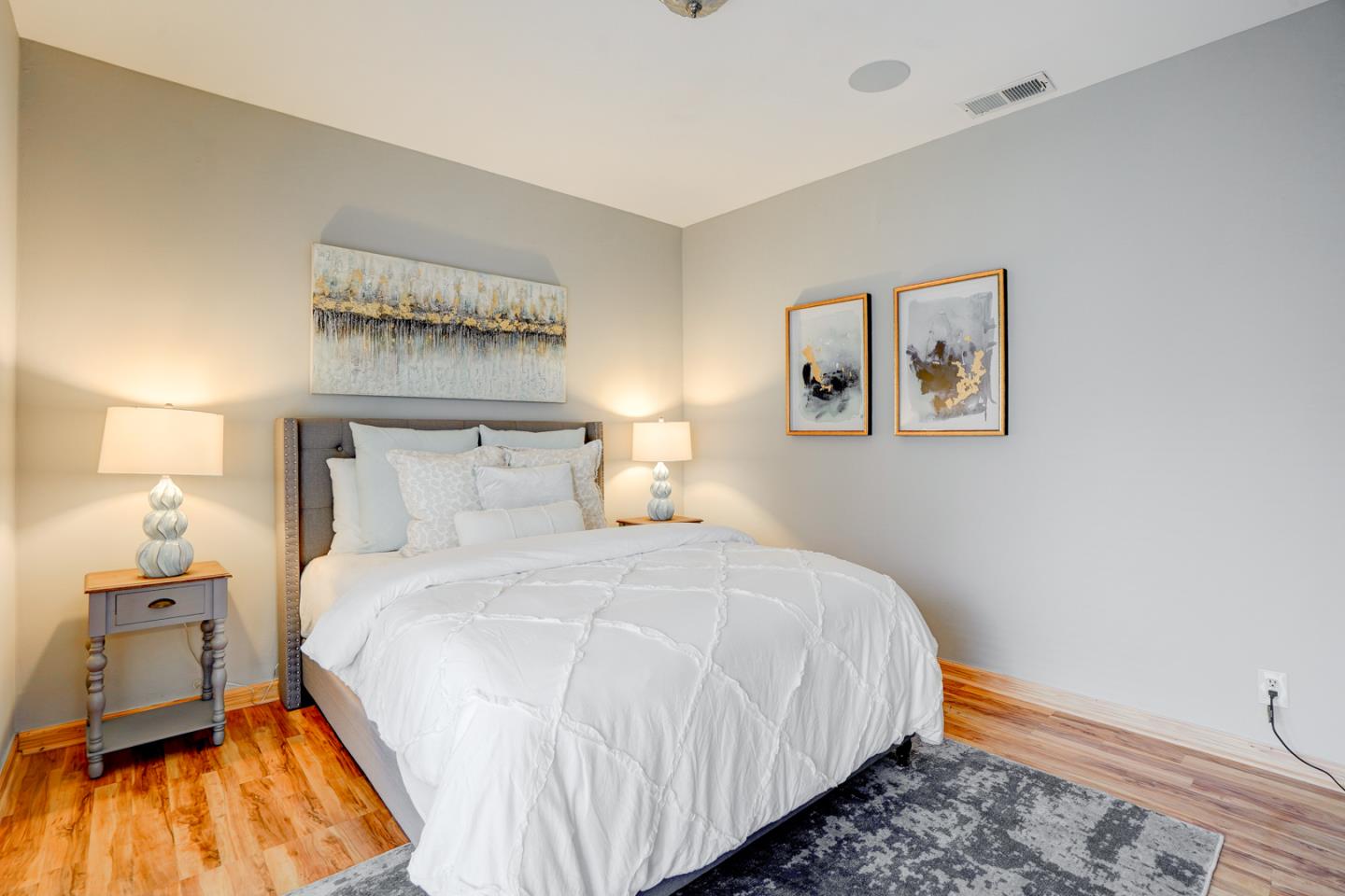 350 Buckingham Way Pacifica, CA 94044 - Photo 28 of 68 a bedroom with a bed and painting on the wall