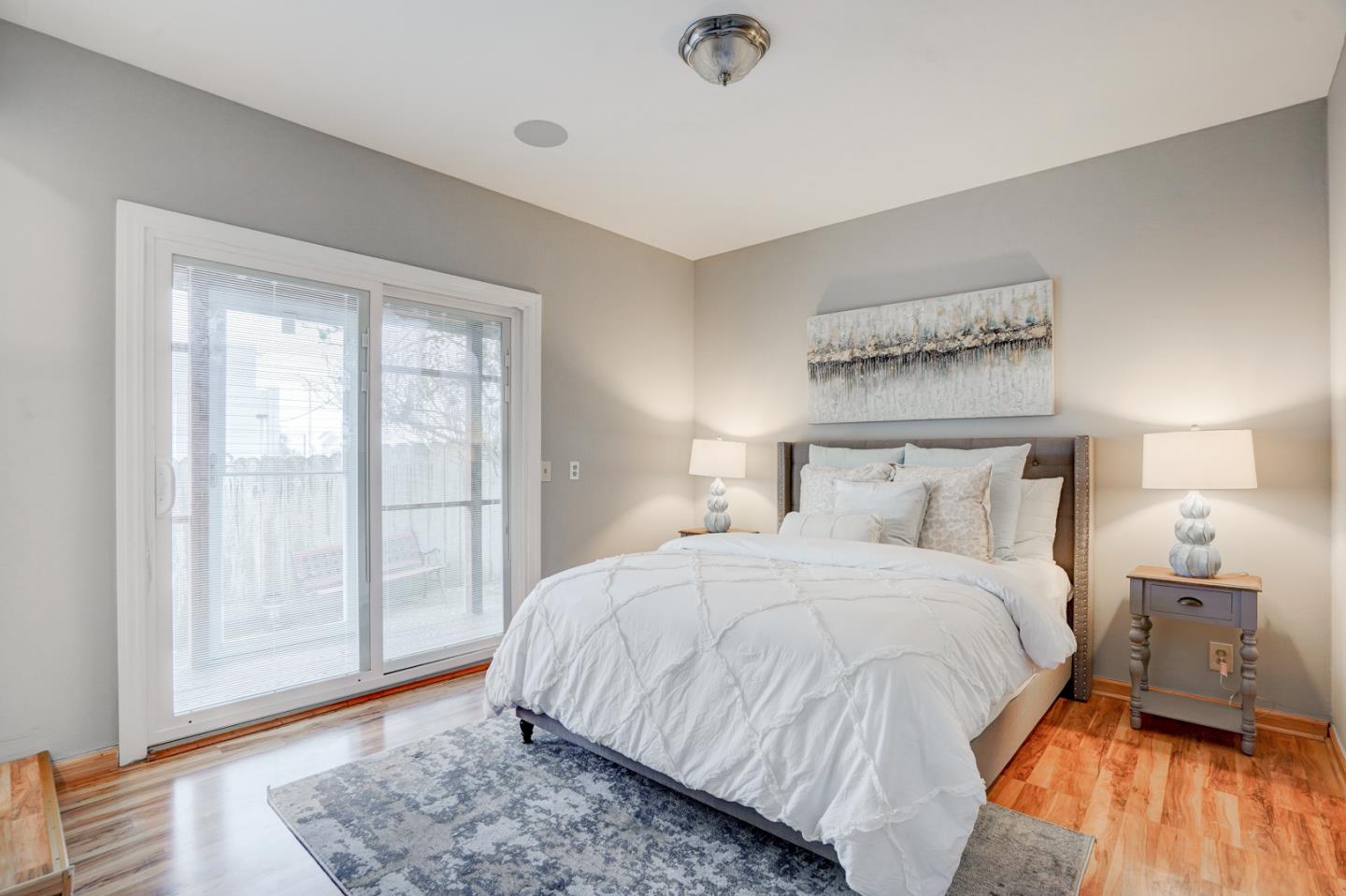 350 Buckingham Way Pacifica, CA 94044 - Photo 29 of 68 a bedroom with a bed and wooden floor