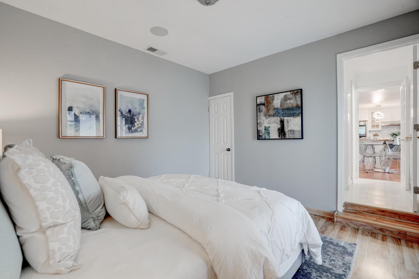 350 Buckingham Way Pacifica, CA 94044 - Photo 31 of 68 a bedroom with a bed and wooden floor