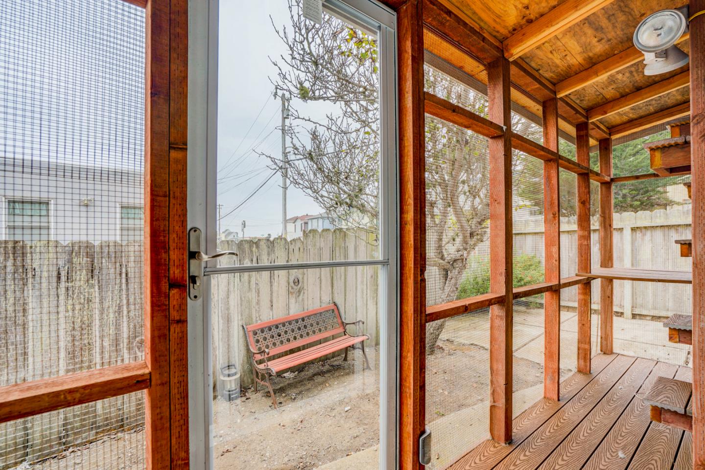 350 Buckingham Way Pacifica, CA 94044 - Photo 32 of 68 a view of a balcony with wooden floor and iron stairs