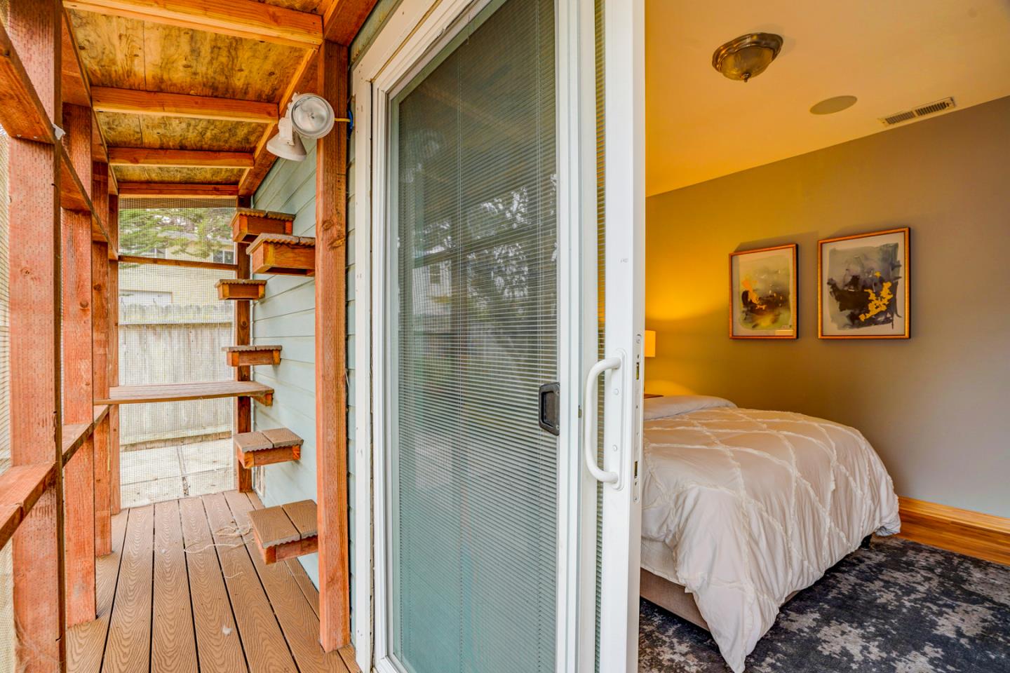 350 Buckingham Way Pacifica, CA 94044 - Photo 33 of 68 a bedroom with a bed and a glass door shower