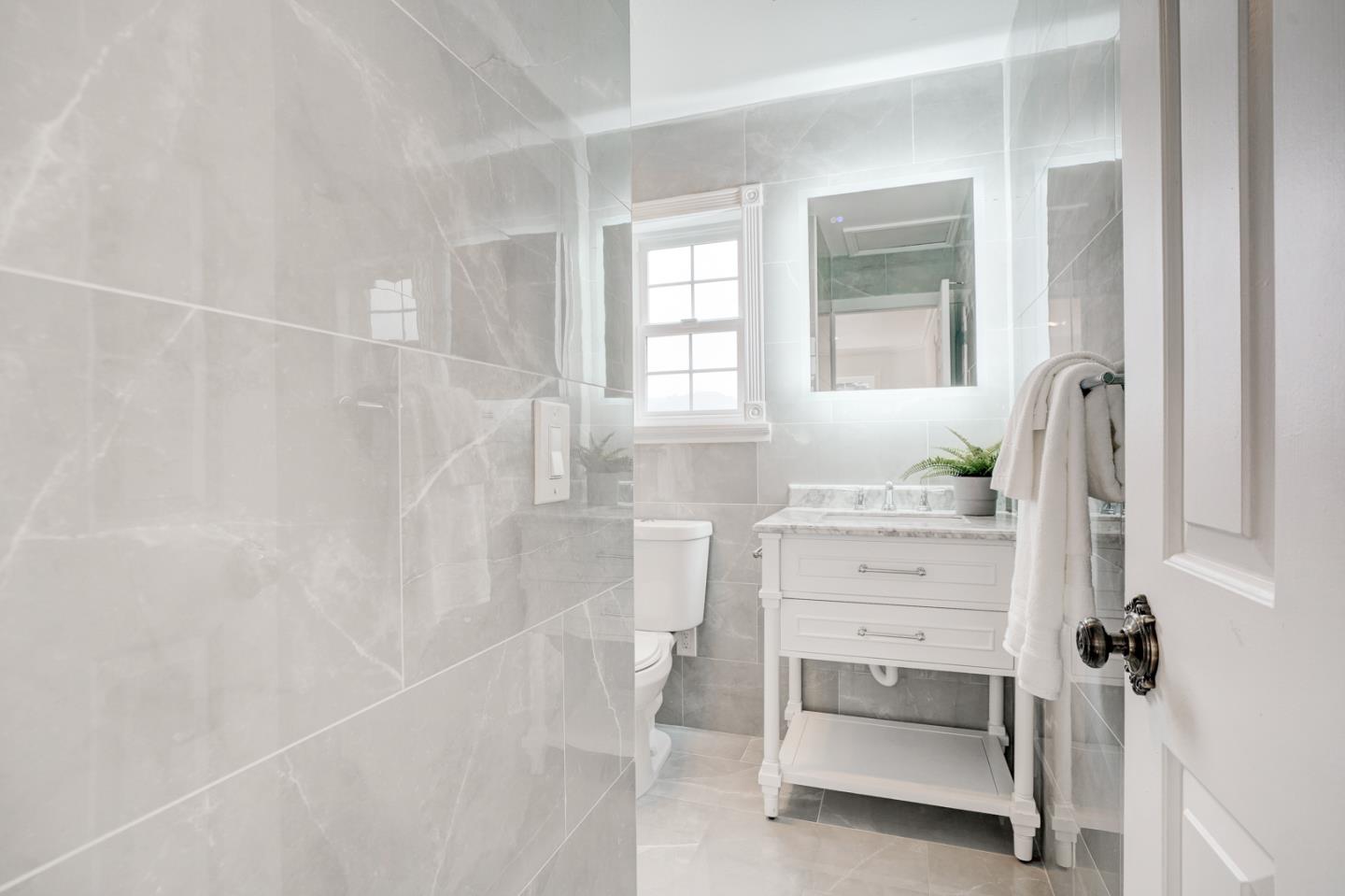 350 Buckingham Way Pacifica, CA 94044 - Photo 41 of 68 a bathroom with a tub sink and mirror