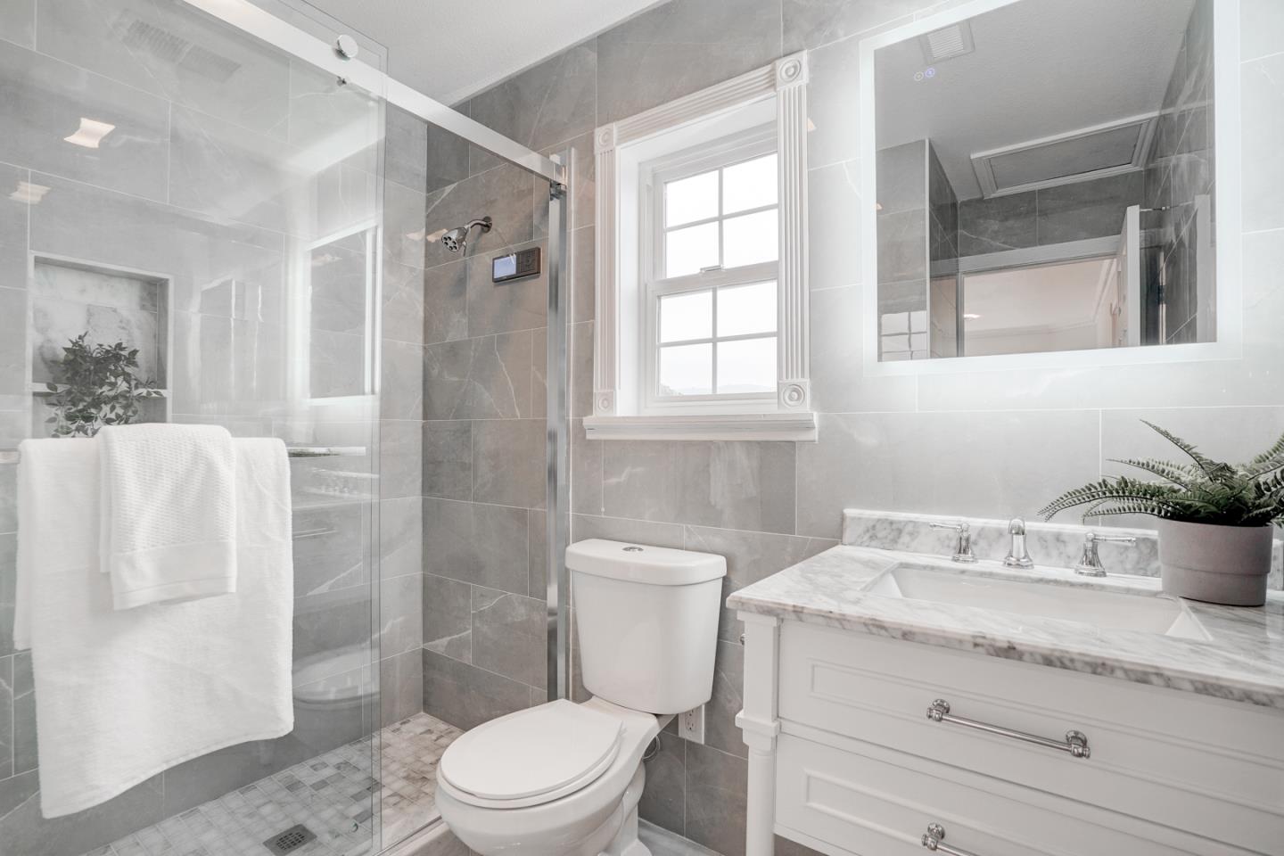350 Buckingham Way Pacifica, CA 94044 - Photo 42 of 68 a bathroom with a granite countertop sink toilet and shower