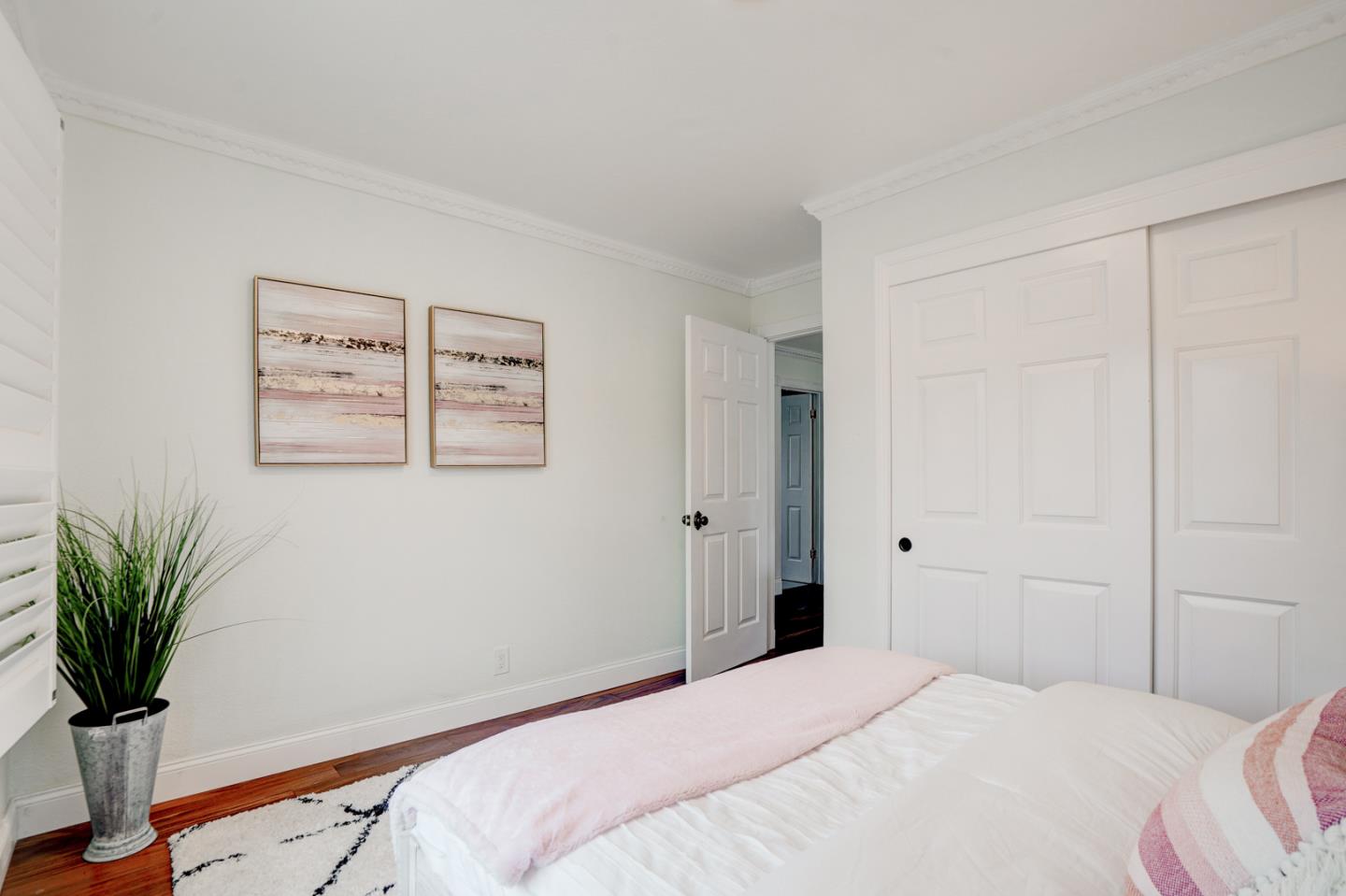 350 Buckingham Way Pacifica, CA 94044 - Photo 48 of 68 a bedroom with a bed and a potted plant