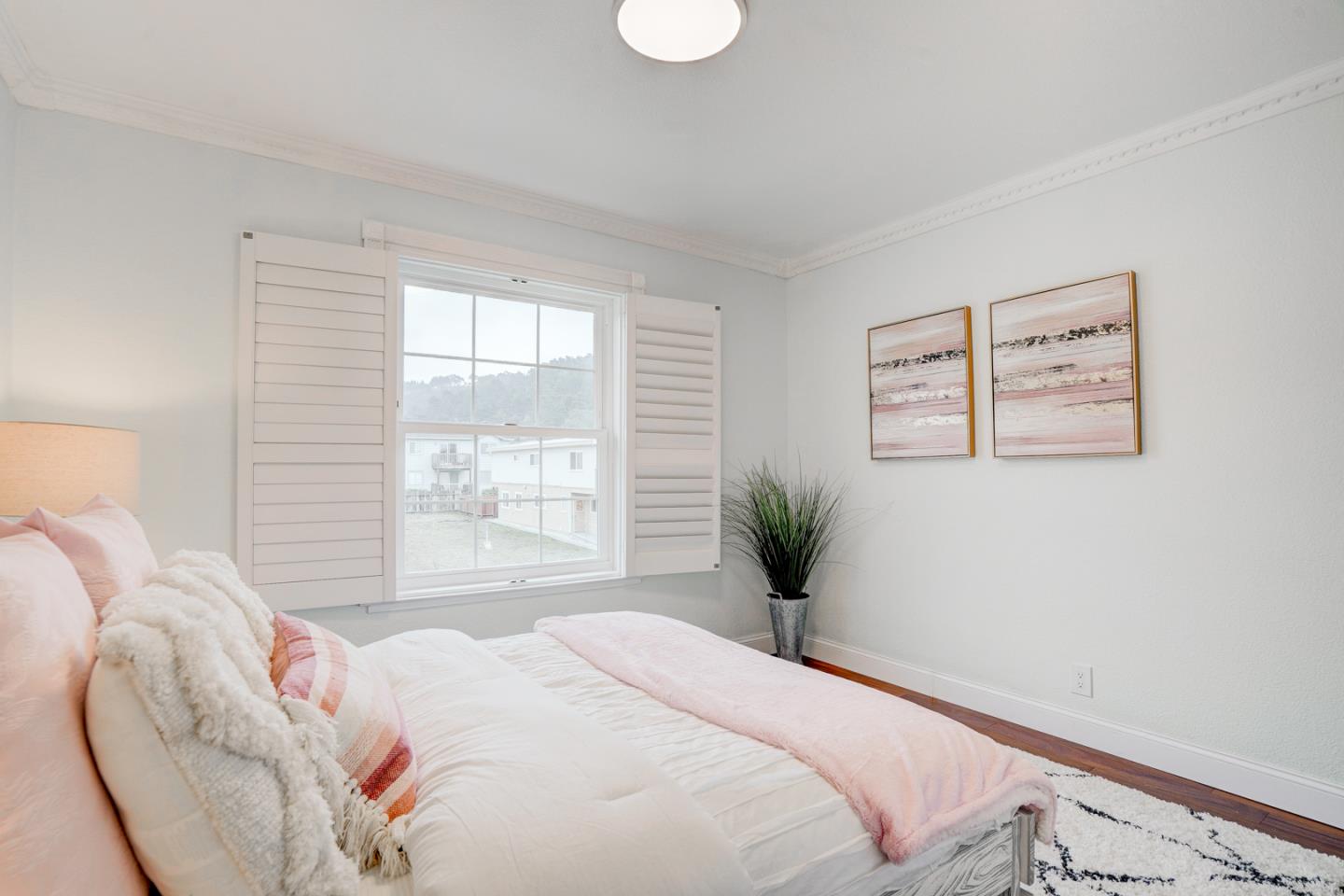 350 Buckingham Way Pacifica, CA 94044 - Photo 49 of 68 a bedroom with a bed and a window