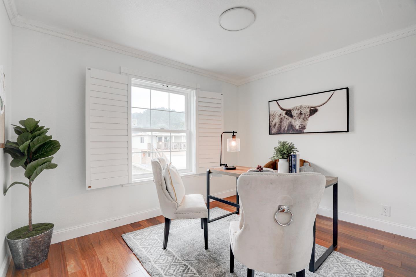 350 Buckingham Way Pacifica, CA 94044 - Photo 50 of 68 a living room with furniture and a potted plant