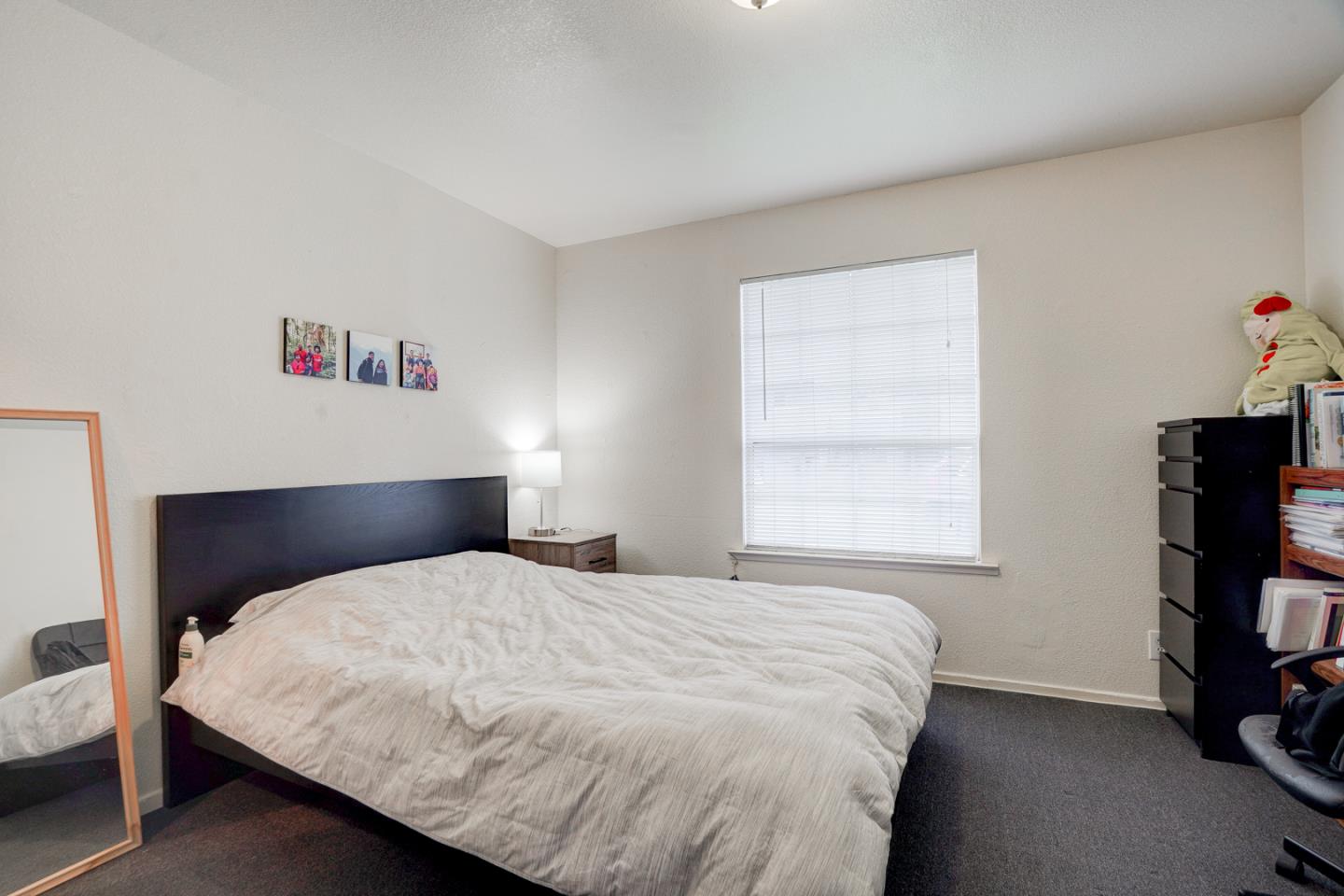 350 Buckingham Way Pacifica, CA 94044 - Photo 59 of 68 a bedroom with a bed and a window