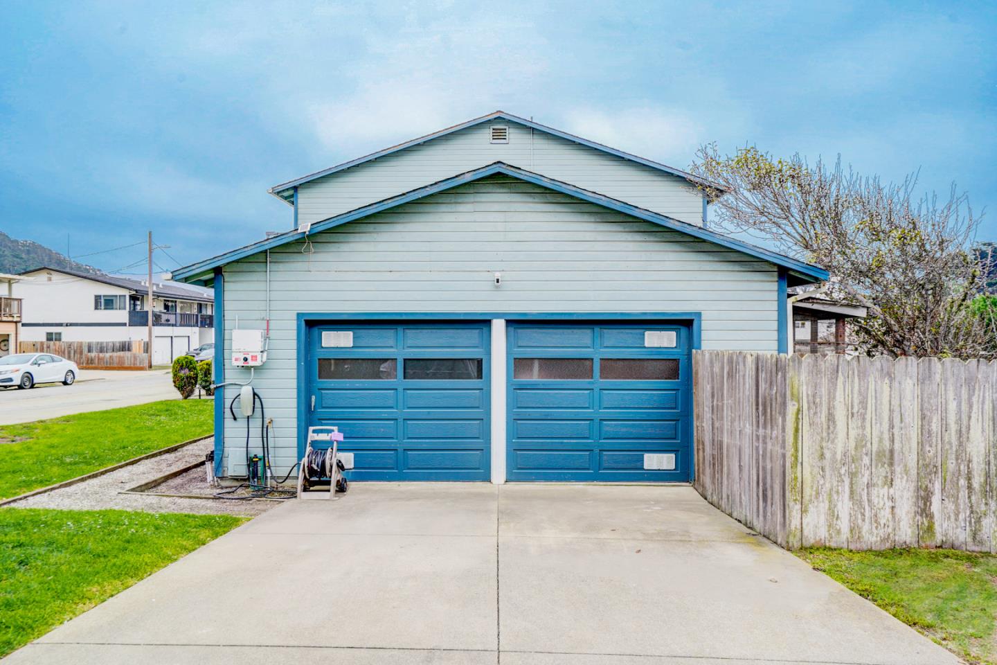 350 Buckingham Way Pacifica, CA 94044 - Photo 62 of 68 a view of a house with a yard and garage