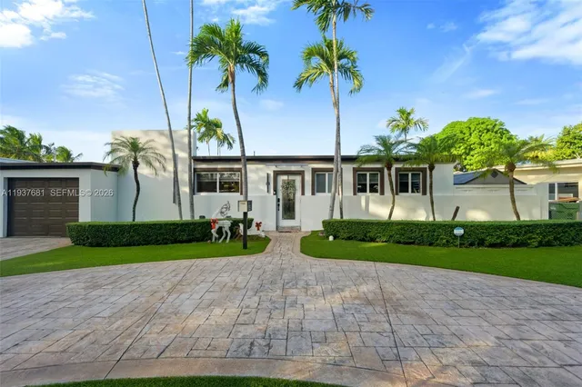 a front view of a house with garden and porch
