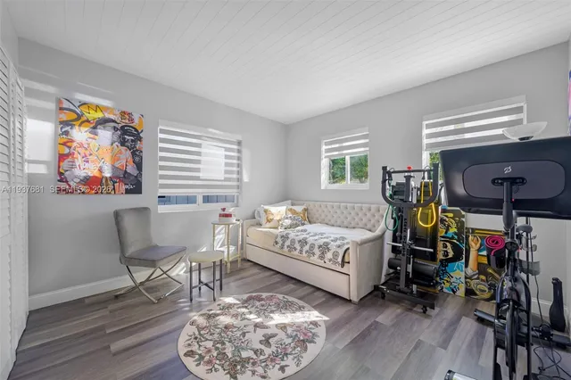 a bedroom with bed and a window