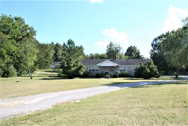 a view of a swimming pool and a yard