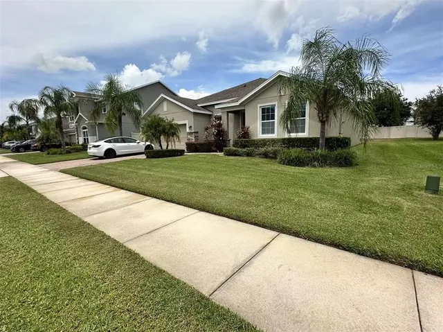 a front view of house with yard and green space