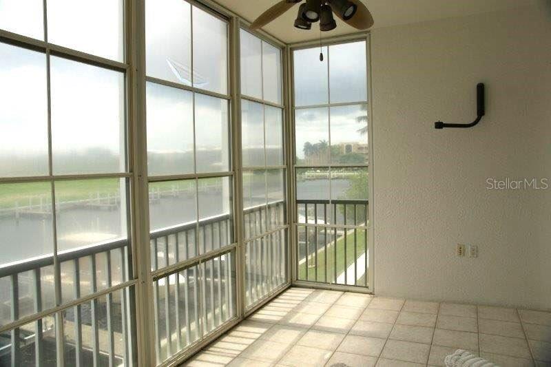 268 Lewis Circle, Unit 121 Punta Gorda, FL 33950 - Photo 13 of 27 a view of an empty room with glass door