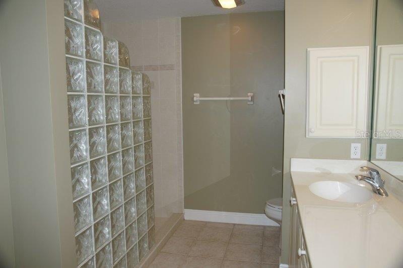 268 Lewis Circle, Unit 121 Punta Gorda, FL 33950 - Photo 17 of 27 a bathroom with a sink and a shower