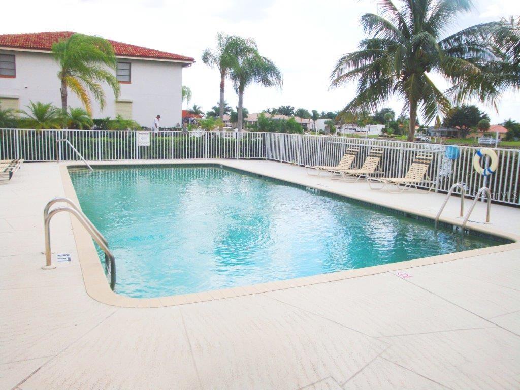 268 Lewis Circle, Unit 121 Punta Gorda, FL 33950 - Photo 2 of 27 a view of a swimming pool with a lake view