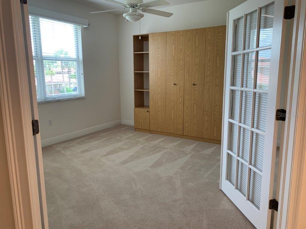 268 Lewis Circle, Unit 121 Punta Gorda, FL 33950 - Photo 21 of 27 an empty room with windows