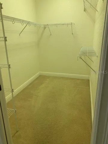 a bathroom with a sink toilet and mirror