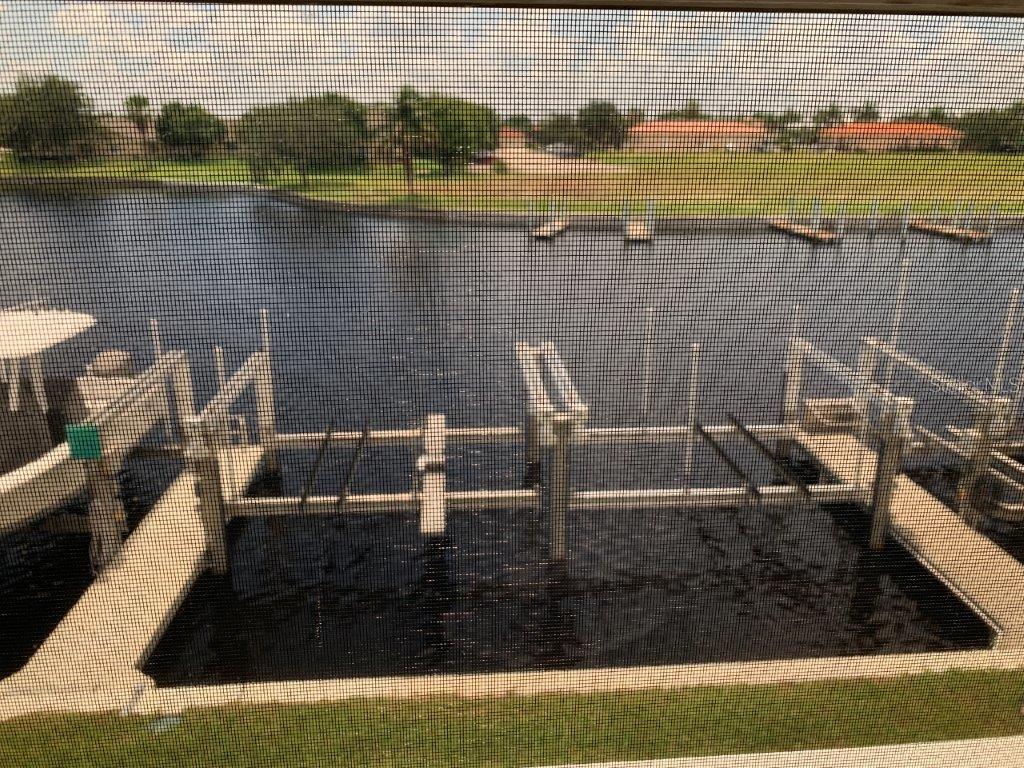 268 Lewis Circle, Unit 121 Punta Gorda, FL 33950 - Photo 27 of 27 a view of a lake with a house
