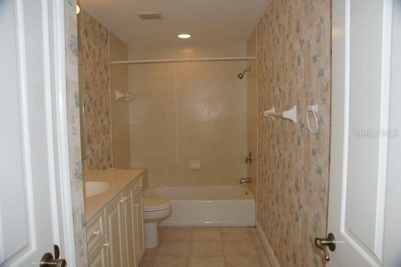268 Lewis Circle, Unit 121 Punta Gorda, FL 33950 - Photo 8 of 27 a bathroom with a shower and a toilet