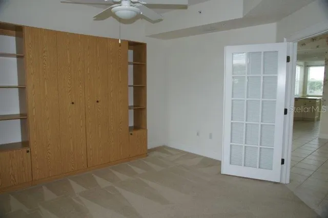 an empty room with closet area