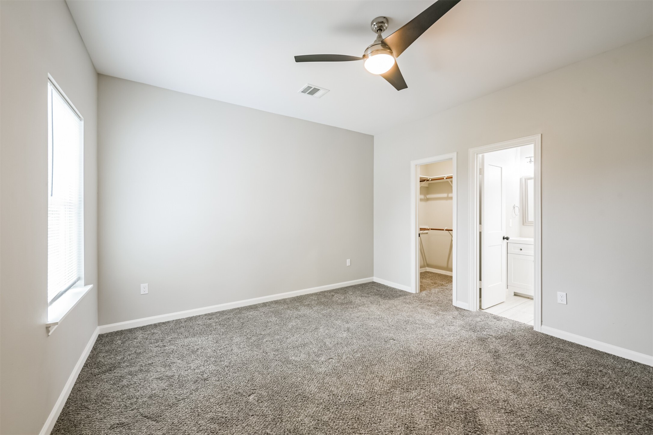 4405 Mallow Street Houston, TX 77051 - Photo 10 of 21 an empty room with windows and fan