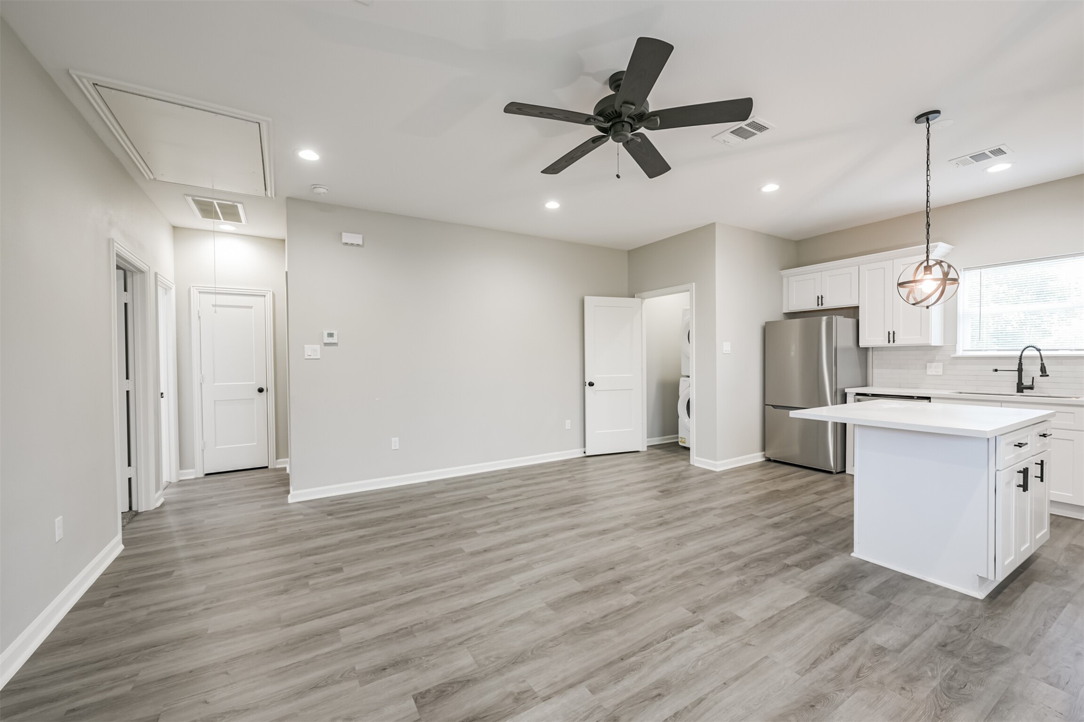 4405 Mallow Street Houston, TX 77051 - Photo 3 of 21 a view of a kitchen with a sink and refrigerator