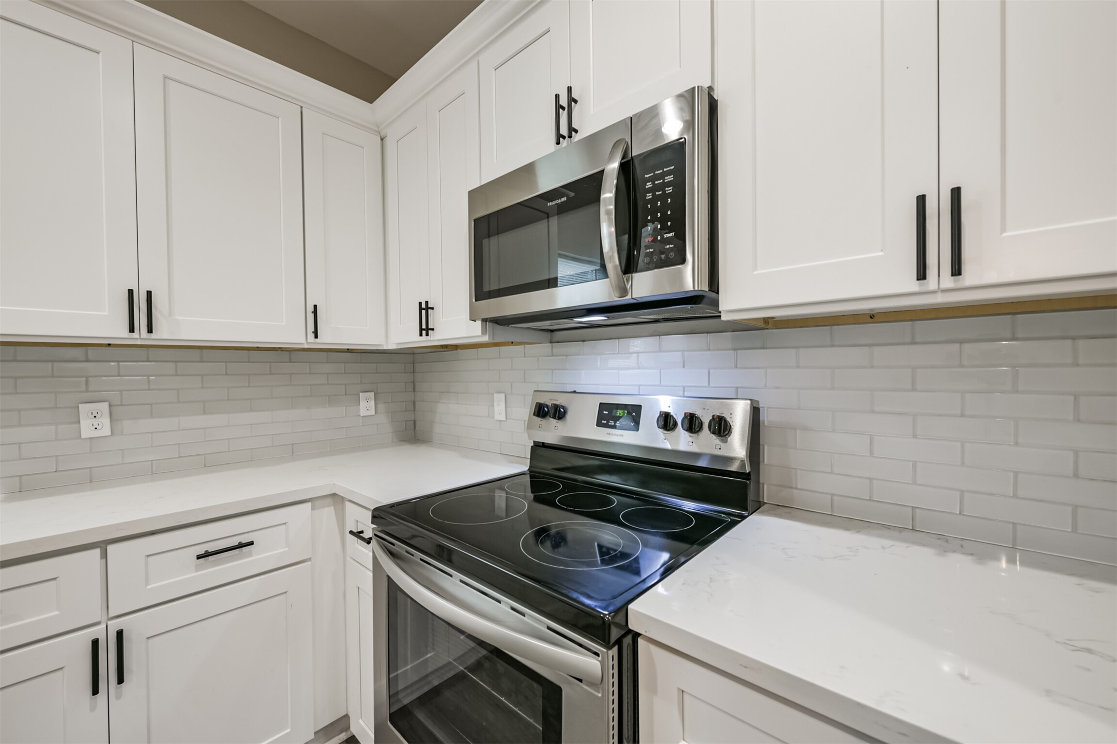 4405 Mallow Street Houston, TX 77051 - Photo 7 of 21 a kitchen with a stove and a microwave