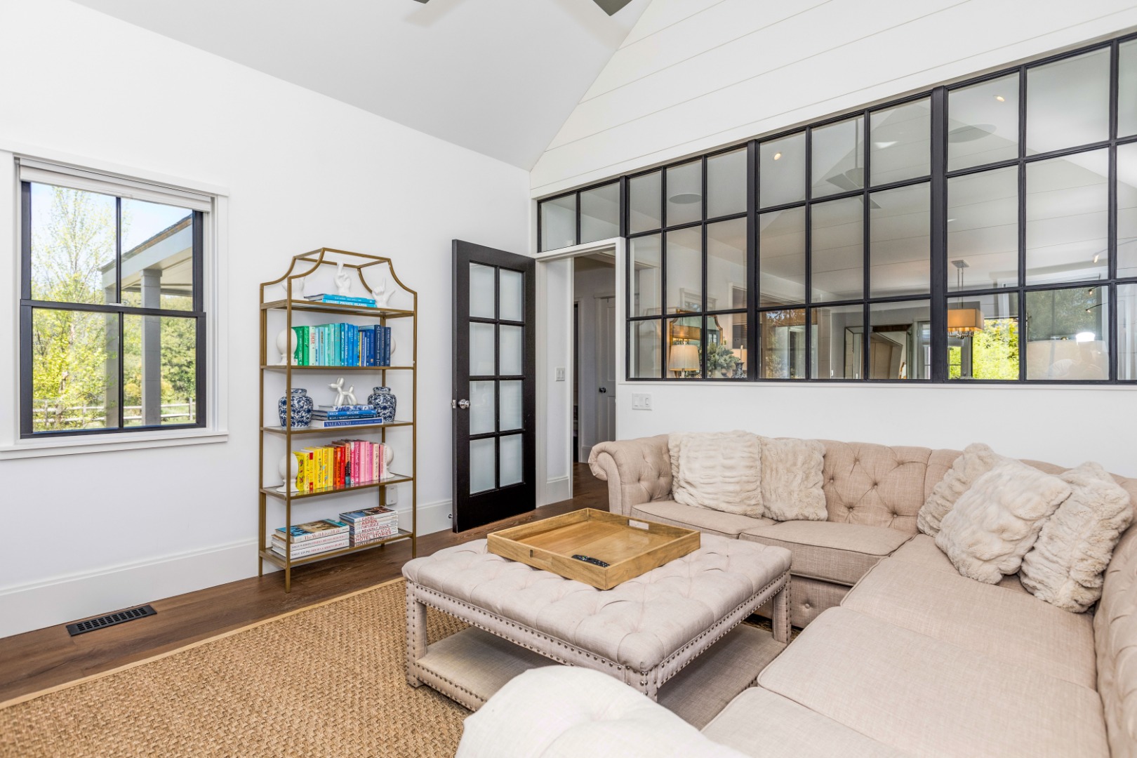 2 Wood Lily Road Nantucket, MA 02554 - Photo 14 of 38 a living room with furniture and a book shelf