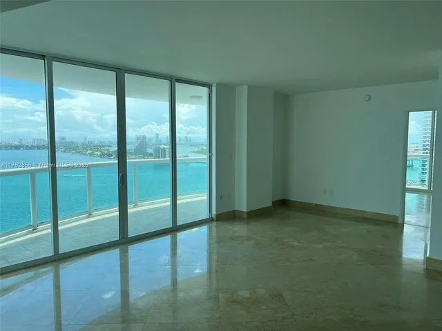 a view of an empty room with a balcony
