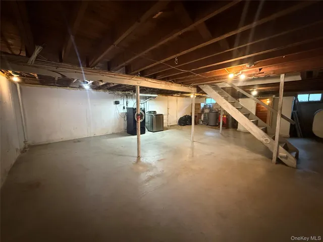 a view of yard covered with snow in front of house