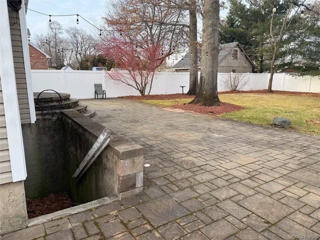 a large house with a large tree in front of it