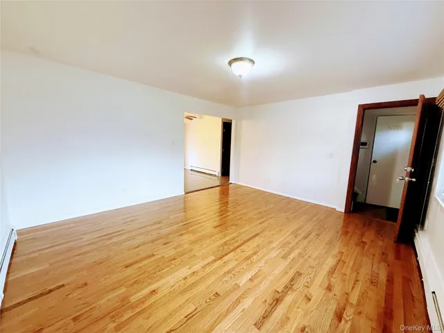 a view of a kitchen with a sink and a refrigerator