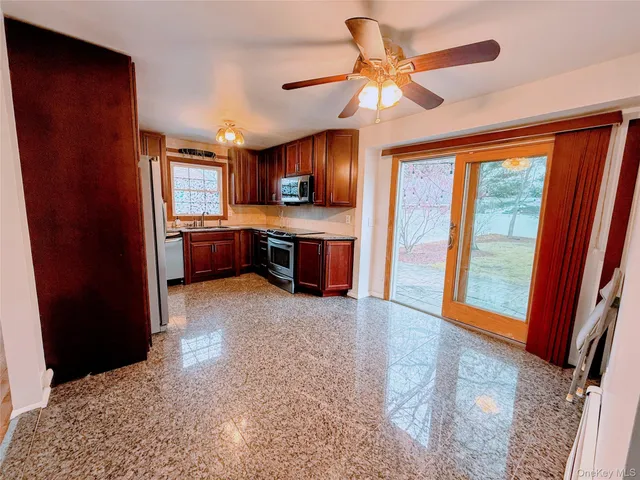 a bathroom with a toilet and bathtub