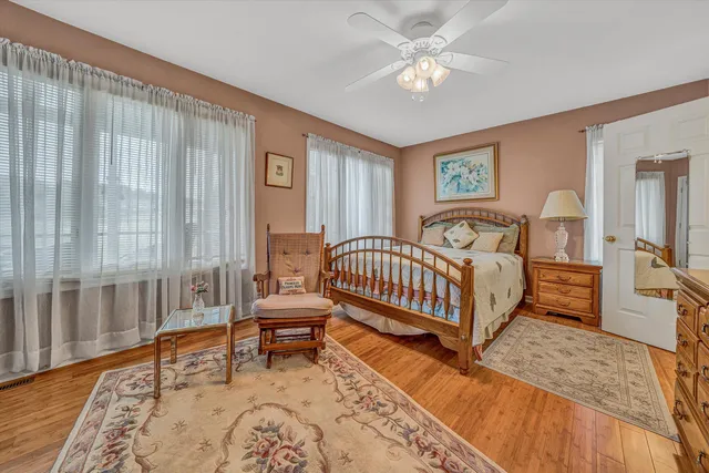 a bedroom with a bed and a table