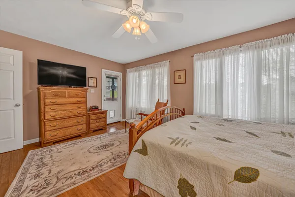 a bedroom with a bed and a television