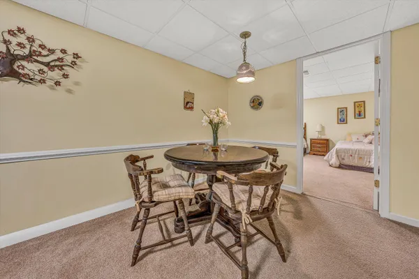 a bedroom with a bed and a table