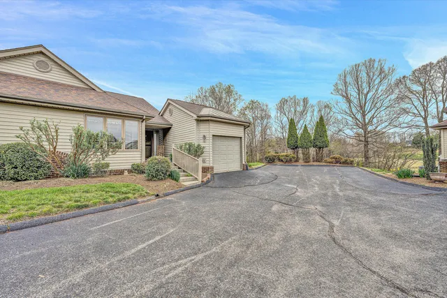 an aerial view of a house with a ocean view