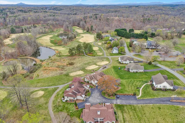 a view of swimming pool with a yard