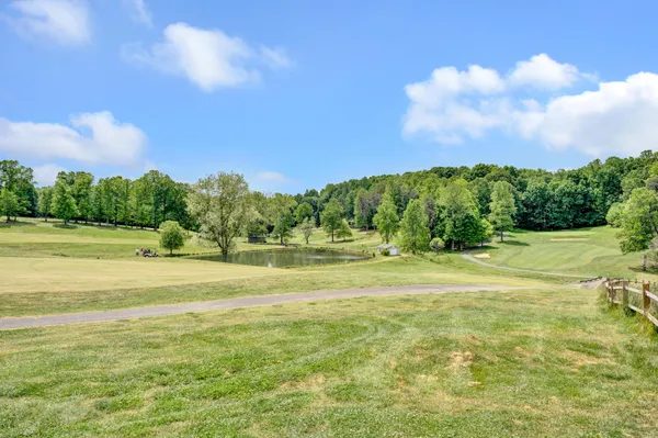 a view of a golf course with a lake
